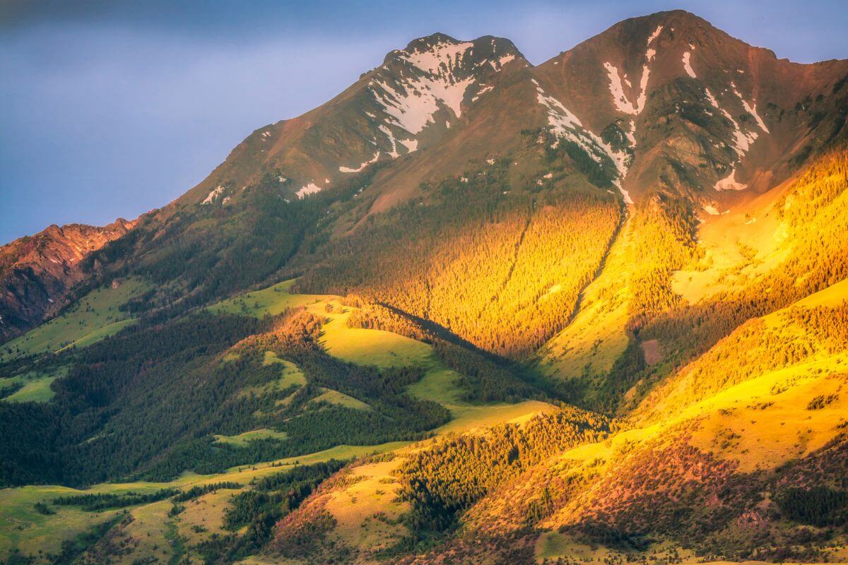 Sunlight shining on a mountainside in Montana on a summer day.