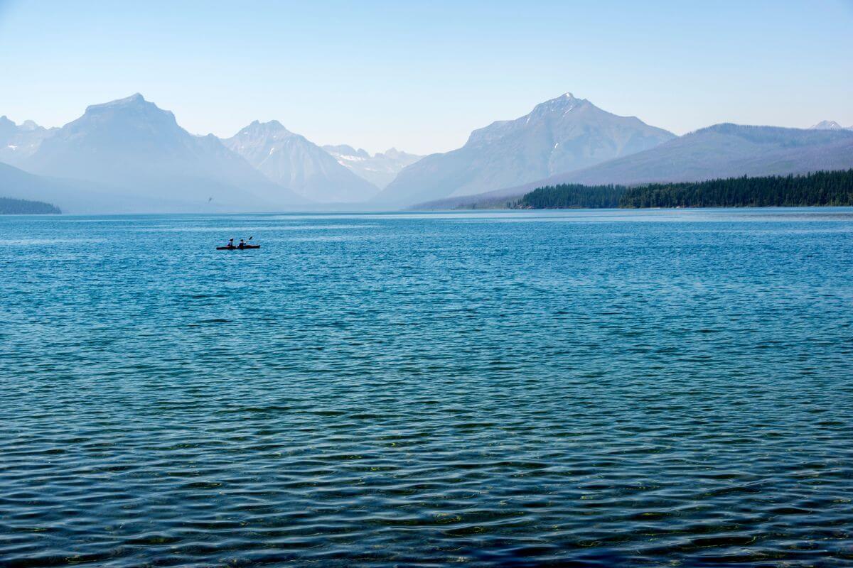 A picturesque lake surrounded by majestic mountains.